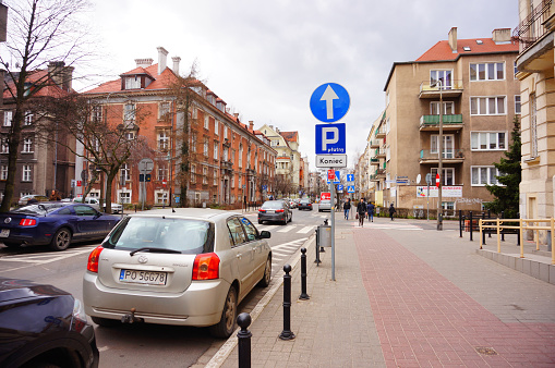 Poznan, Poland - March 8, 2019: Parked Toyota Corolla car on a parking sport by a sidewalk on the Slowackiego street in the city center. Parking spots are paid.