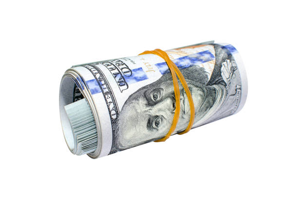 istock Roll of hundred dollar bills isolated on white background closeup 1135732559