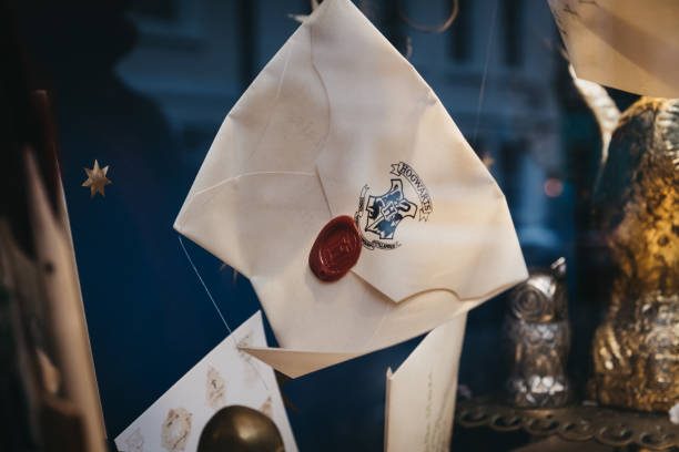 Harry Potter Hogwarts letters on a retail window display of MinaLima store in Covent Garden, London, UK. stock photo