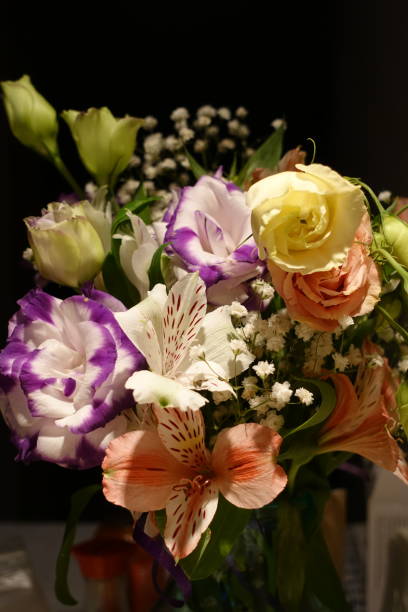 istock Beautiful wedding bouquet composed of different flowers on a black background. 1135736227
