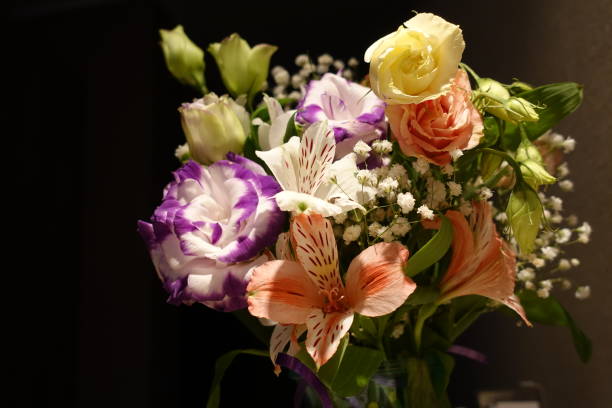 istock Beautiful wedding bouquet composed of different flowers on a black background. 1135736248