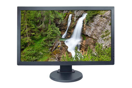 Computer monitor isolated on white with screensaver running