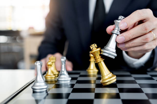 istock Midsection Of Businessman Playing Chess 1135740511