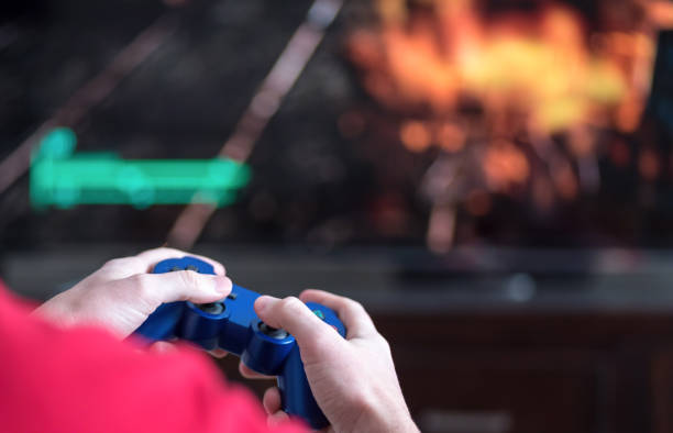 istock Close-Up Of Hands Holding Video Game Remote Control 1135741343