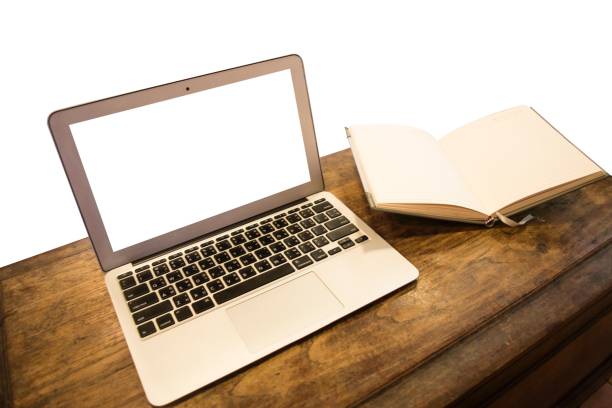 istock High Angle View Of Laptop On Wooden Table Against White Background 1135742189