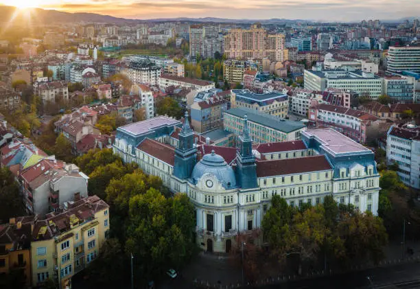Panoramic high angle view above Western city of Sofia, Bulgaria, Eastern Europe during sunset back light. Shot on Canon EOS full frame system with tilt-shift prime lens.
