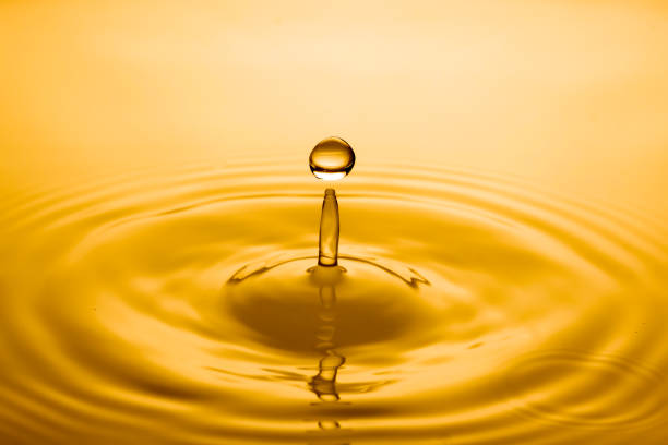 istock Close-Up Of Drop Falling In Water 1135742985