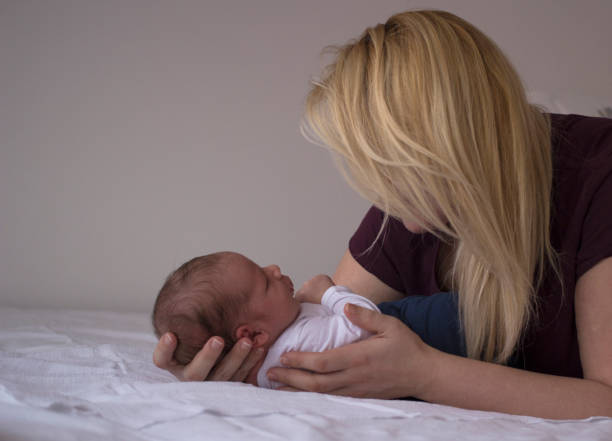 istock Newborn baby boy with his mother 1135743943