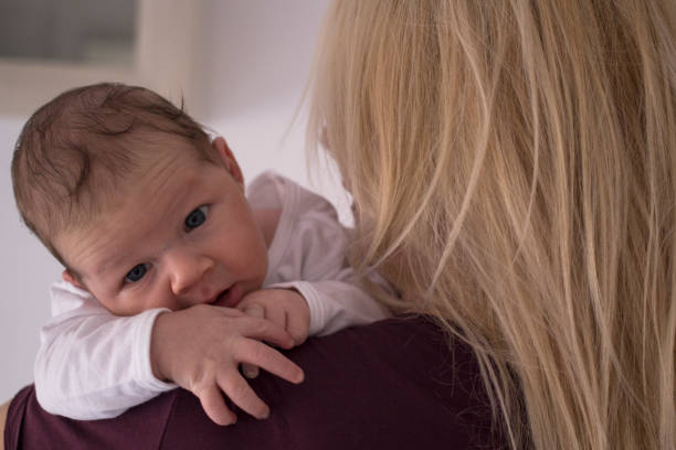 istock Newborn baby boy with his mother 1135744392