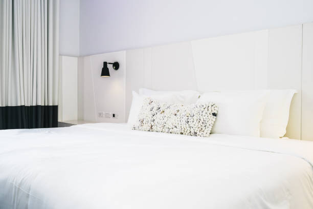 istock White pillow on bed decoration in beautiful luxury bedroom interior 1135746008