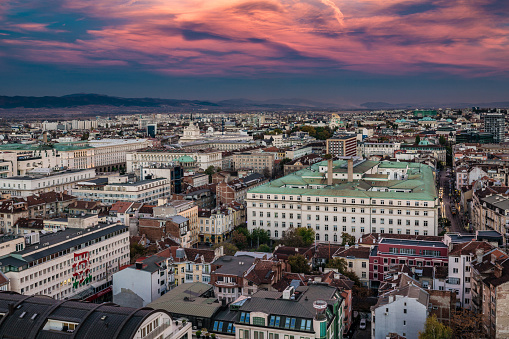 Detailed panoramic high angle aerial view above Eastern downtown district in city of Sofia, Bulgaria, Eastern Europe during golden hour minutes after spectacular sunset. Shot on Canon EOS full frame system. Image is ideal for background with plenty of copy space.