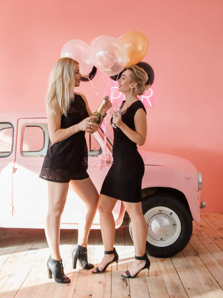 istock birthday congratulation best friends open bottle 1135747321