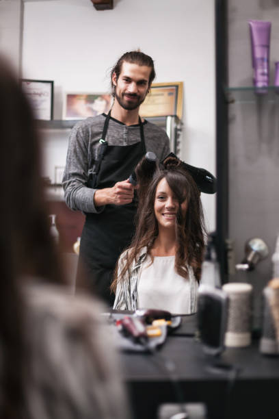 istock Hairdresser working in his studio 1135747627