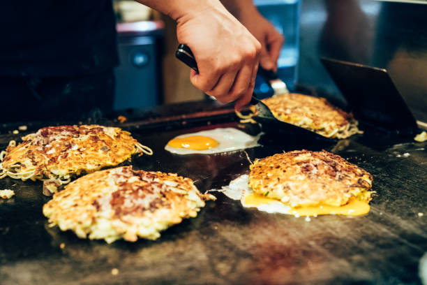istock Chef making delicious food teppanyaki restaurant 1135749012