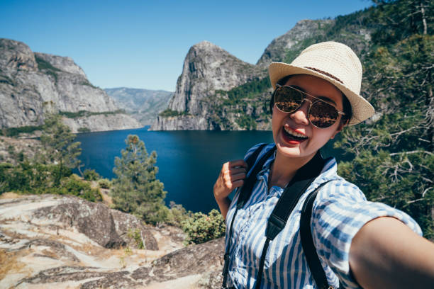 istock asian taking selfie with o shaughnessy dam 1135750330