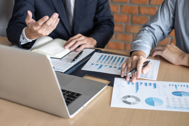 istock Business People Working On Desk 1135750682