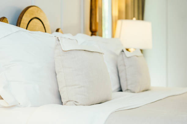 istock White pillow on bed decoration in beautiful luxury bedroom interior 1135754174