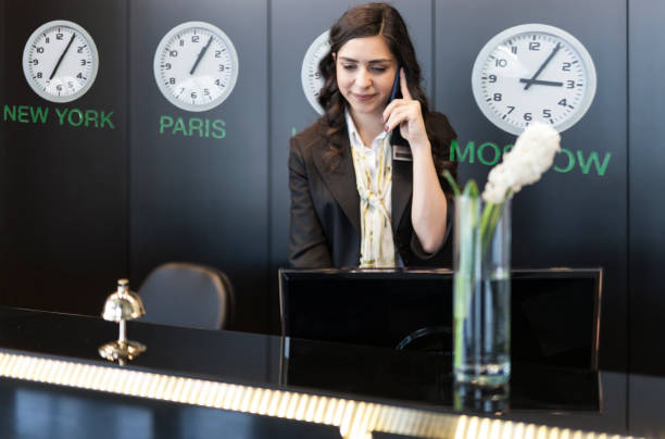 istock Woman running the front desk at a hotel 1135755170