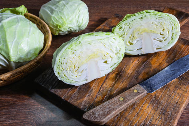istock Prepare the cabbage to cook on the kitchen table. 1135755700