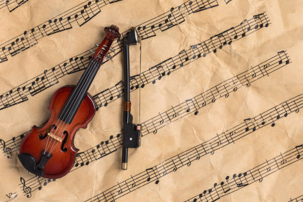 istock Violin on antique paper music notes with copy space 1135757604