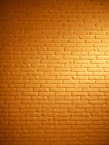istock Background of brown brick textured vintage wall with light pattern 1135763377