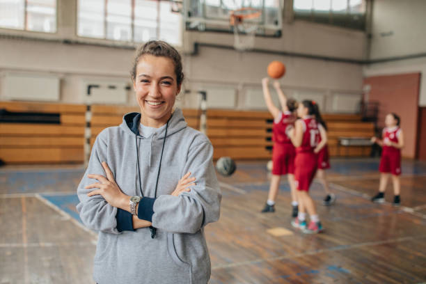 istock Female coach and basketball team 1135763381