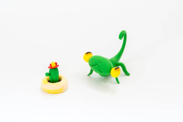 istock Colorful plasticine chameleon and cactus plants 1135765429