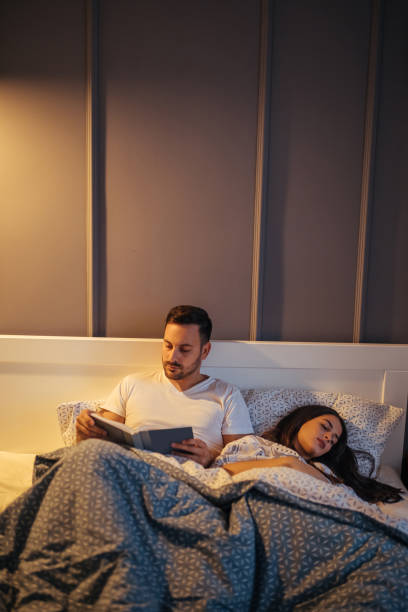 istock Stories in bed next to loved one 1135765456