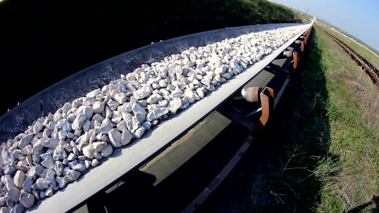 Fisheye of a conveyor belt transporting stones