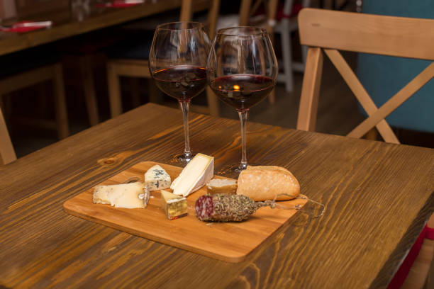 istock Red wine and assorted cheese plate with sausage 1135765933
