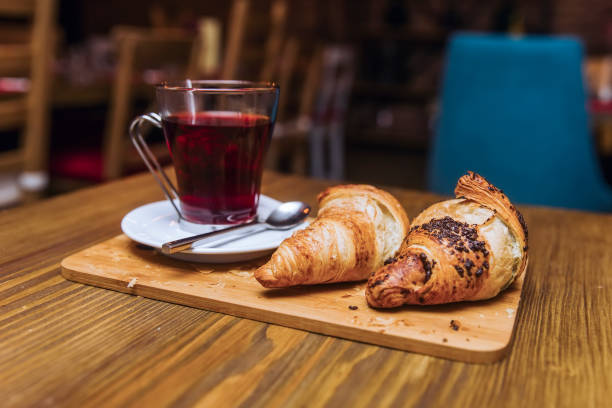istock Fresh croissants and tea  for breakfast 1135765942