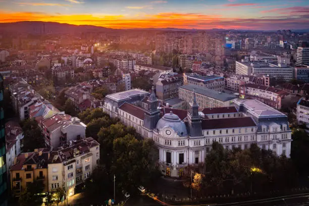 Panoramic high angle view above Western city of Sofia, Bulgaria, Eastern Europe during sunset back light into the sky. Shot on Canon EOS full frame system with tilt-shift prime lens.