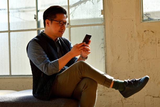 istock Chinese Man Relaxing in Corner of His Office during Lunch Break 1135767332