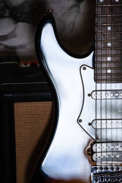 istock close-up shot of shiny guitar case and amplifier 1135767924