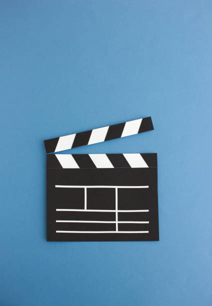 istock Cutout of clapperboard on blue background 1135769080