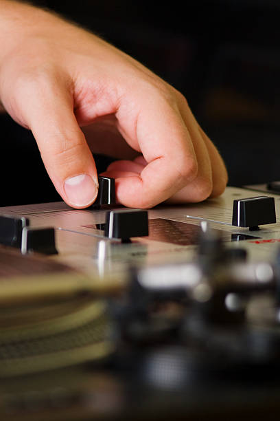 istock Hand of a dj adjusting the crossfader 113577016