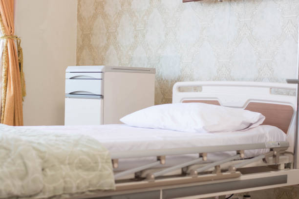 istock focused indoors empty hospital room with comfortable bed with pillow and electrical support at day light 1135770760