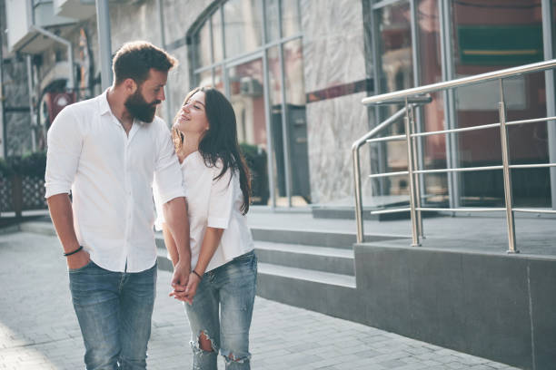 istock A young funny loving couple have fun on a sunny day. 1135771393