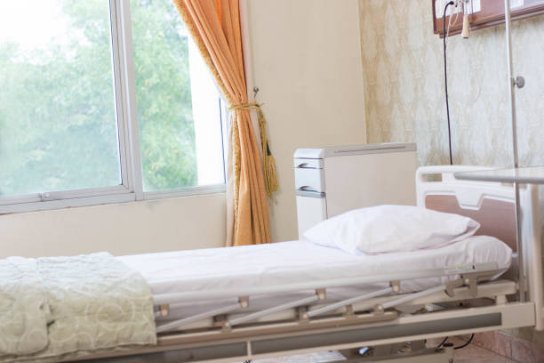 istock focused indoors luxury empty hospital room with comfortable bed with pillow in white satin and electrical support at day light 1135771614