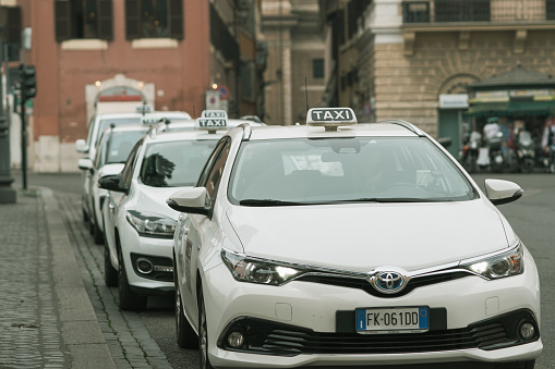 Taxis waiting at the taxi station in popular tourist spot near the Pantheon, in the Roman historical center.