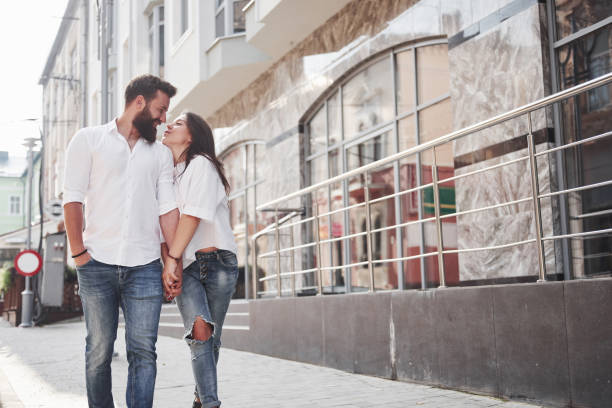 istock A young funny loving couple have fun on a sunny day. 1135771650