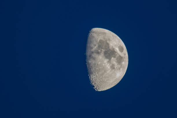 istock Moon in the dark night sky in the first quarter 1135771905