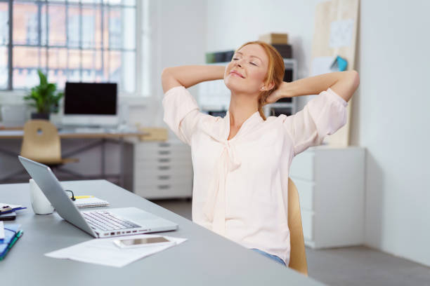istock Happy relaxed successful businesswoman 1135772551