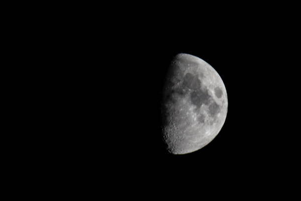 istock Moon in the dark night sky in the first quarter 1135773683
