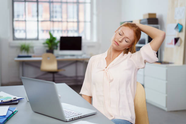 istock Young woman relaxing her neck and shoulders 1135773818