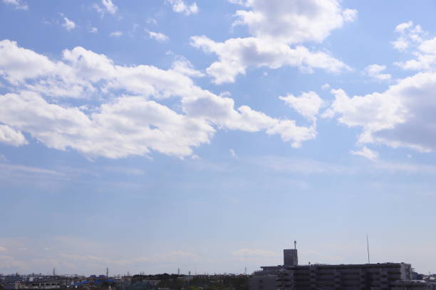 istock town landscape with blue sky and white clouds 1135775288