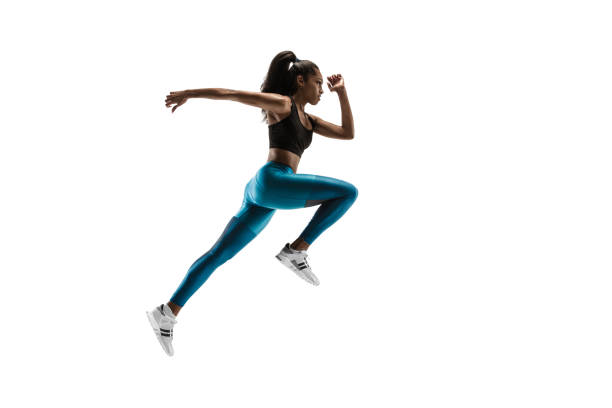 istock Young african woman running or jogging isolated on white studio background. 1135775377