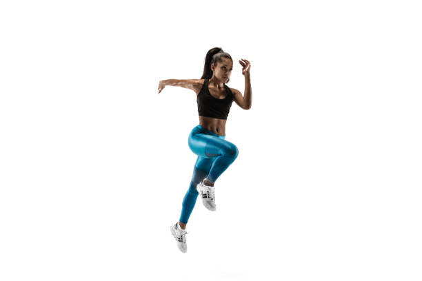 istock Young african woman running or jogging isolated on white studio background. 1135775381