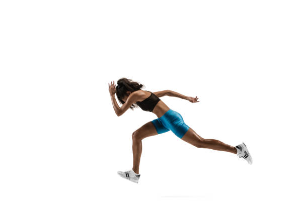 istock Young african woman running or jogging isolated on white studio background. 1135775386