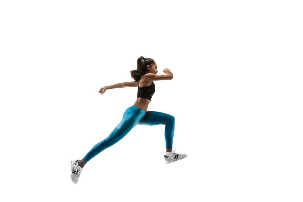 istock Young african woman running or jogging isolated on white studio background. 1135775387